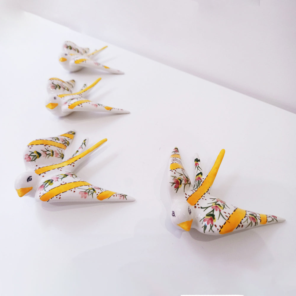 Portuguese ceramic swallow, handpainted with yellow striped and flowers.