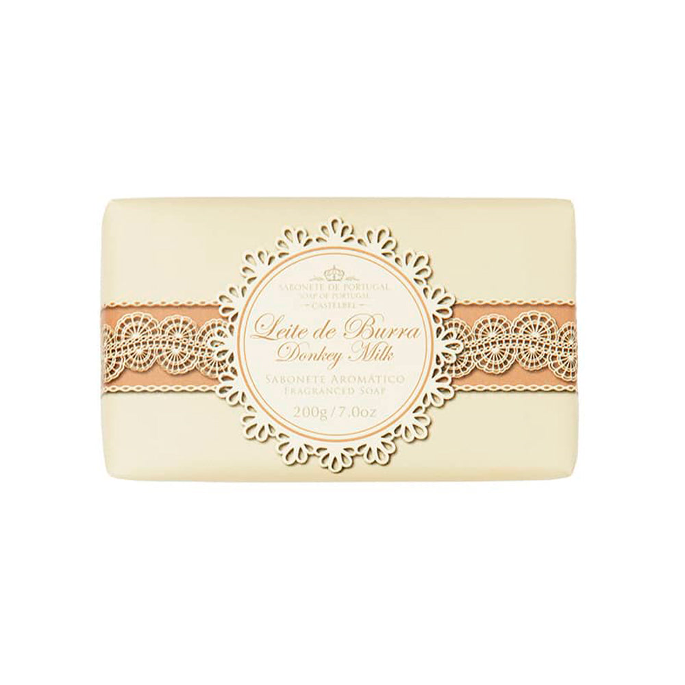 A rectangular bar of handmade soap with a beige and brown ornate label reading "Castelbel Donkey’s Milk Soap 200g" and additional descriptions in smaller text, set against a white background.