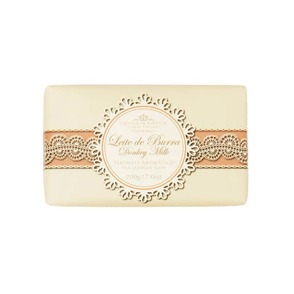 A rectangular bar of handmade soap with a beige and brown ornate label reading "Castelbel Donkey’s Milk Soap 200g" and additional descriptions in smaller text, set against a white background.