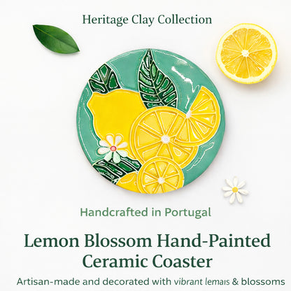 The Lemon Blossom Hand-Painted Ceramic Coaster by Miradouro Ceramics features vibrant yellow lemons, green leaves, and white blossoms. Handcrafted Portuguese artisan homeware.