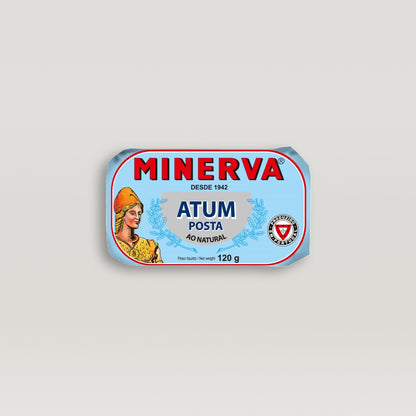 A Minerva solid pack tin of tuna in brine, brimming with flavor, featuring a woman on the label.