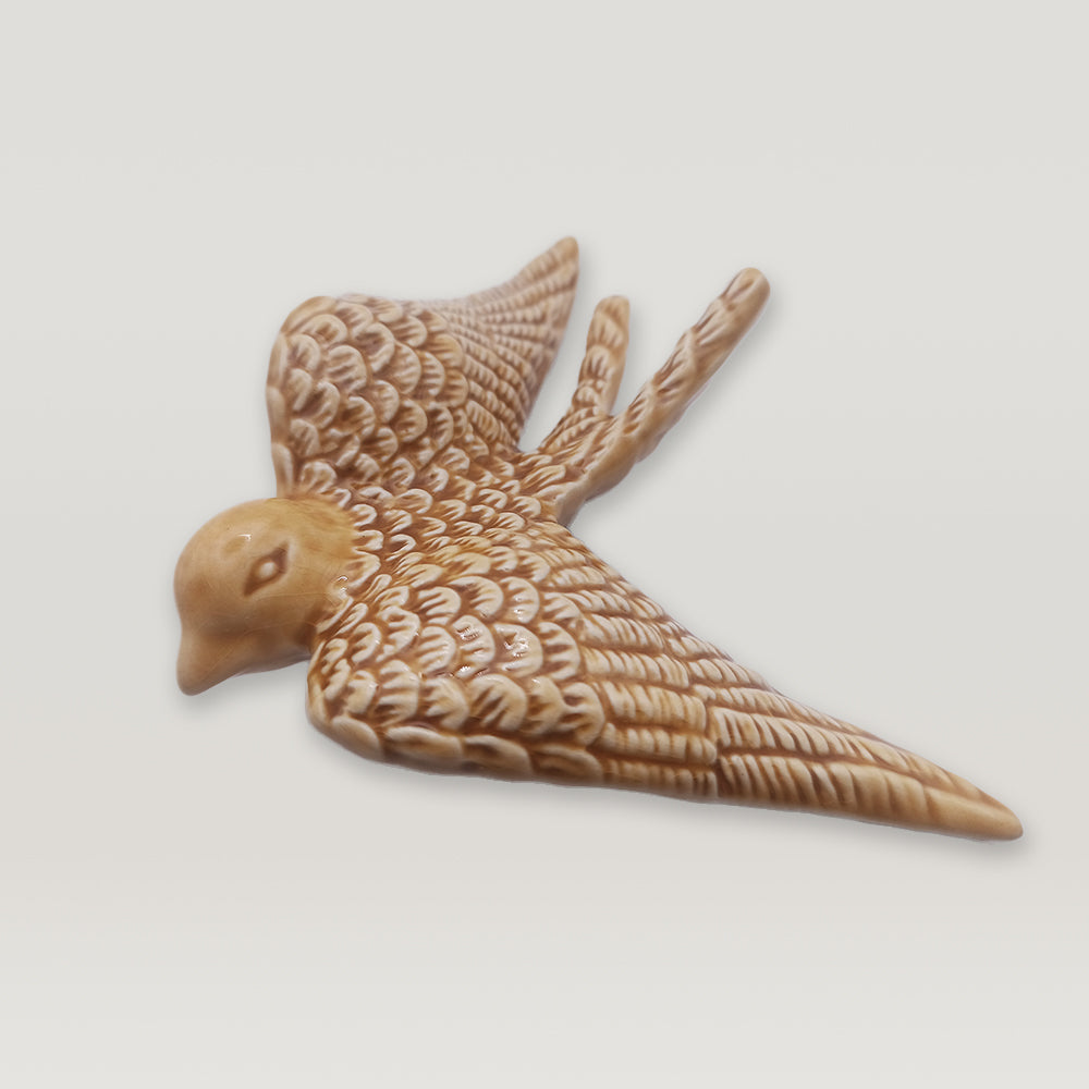 A Tejo Shop Portuguese Ceramic Swallow figurine is shown on a white background.