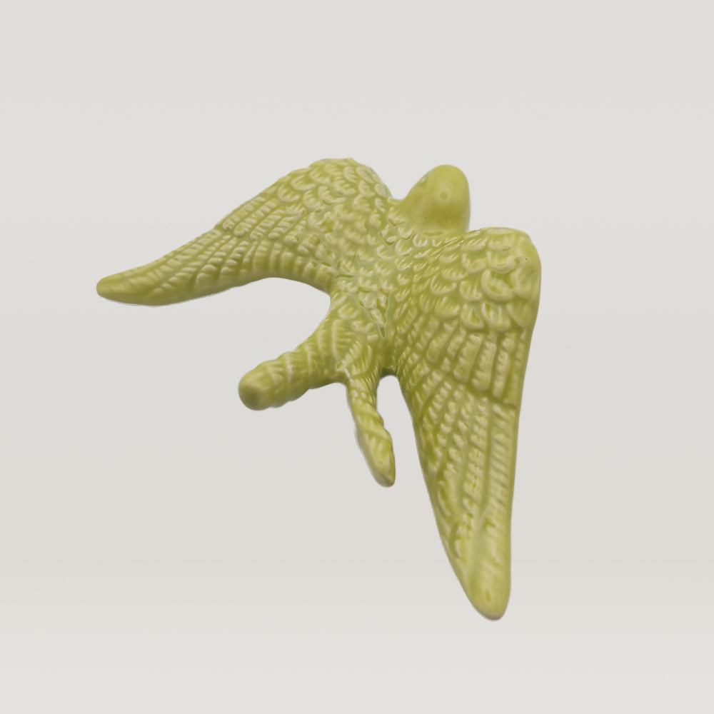 A luxurious addition, a green Tejo Shop Portuguese Ceramic Swallow figurine, 3D printed to perfection.