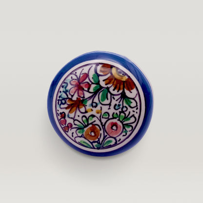 A XVII Century Wine bottle stopper with a floral pattern on a white background by Tejo Shop.