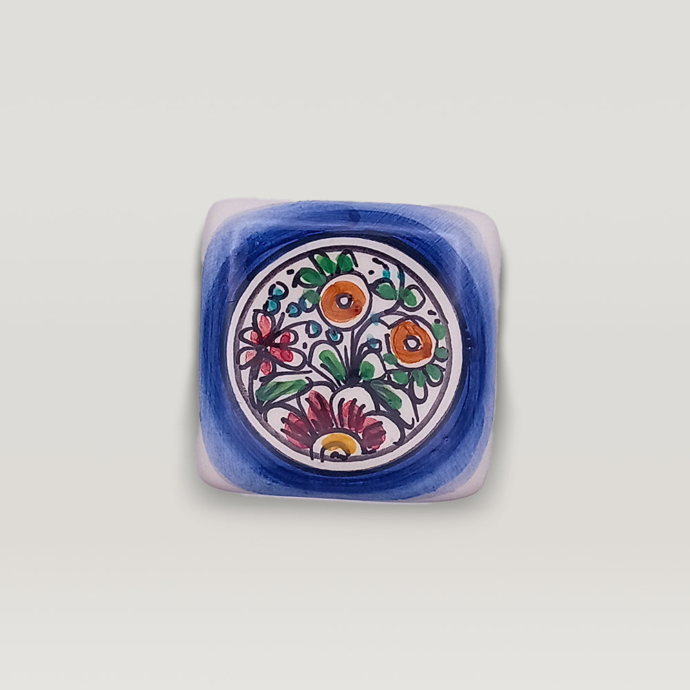 Hand-painted Tejo Shop XVII Century floral ceramic dish on a white background.