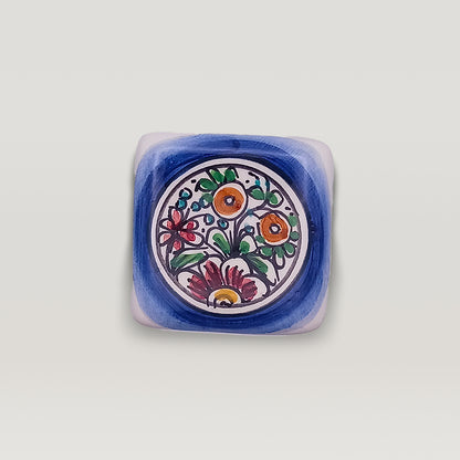 Hand-painted Tejo Shop XVII Century floral ceramic dish on a white background.