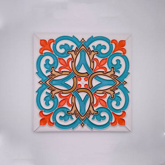 A colorful, Beja Hand Painted Decorative Tile with a symmetrical pattern featuring turquoise and orange floral motifs and beige accents, displayed against a white background by Tejo Shop.