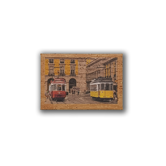 The Yellow & Red - Cork Fridge Magnet by New Jamp features a vintage-style illustration of Lisbon’s iconic red and yellow trams on a lively street, framed in black and capturing classic Portuguese charm.