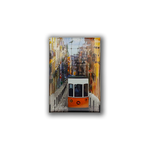 A bright yellow tram ascends a vibrant Lisbon street on the Lisbon Lift - Fridge Magnet by New Jamp, an ideal Portugal souvenir. "Lisboa" appears at the bottom of the image.