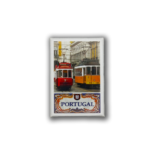 Add a touch of Portugal to your fridge with New Jamp’s "The Red & Yellow" magnet—featuring two vintage trams and historic Portuguese scenery, plus "PORTUGAL" in decorative text.