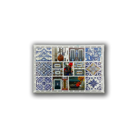 The New Jamp "Portuguese Art" fridge magnet showcases blue and white ceramic tile patterns, the iconic Barcelos rooster, and illustrated scenes of Lisbon with famous landmarks and streetcars.