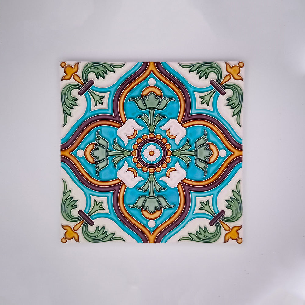 Decorative hand-painted Traditional Spanish Tile featuring a symmetrical pattern with vibrant blue, green, and red colors, accented with white and orange details on a square tile by Tejo Shop.