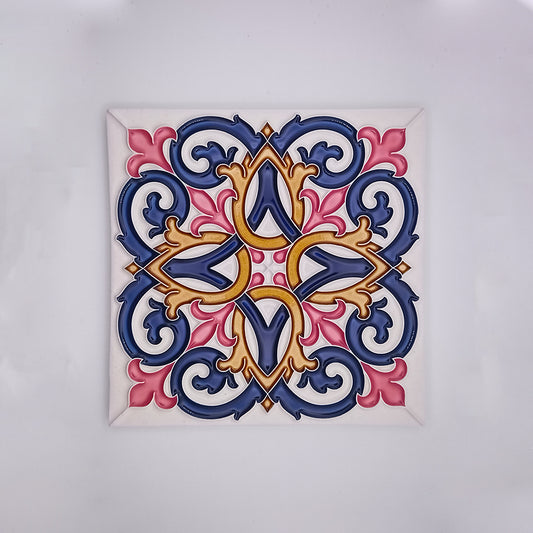 Decorative hand-painted Tejo Shop Porto Wall Tiles Decor with a vibrant, symmetrical floral pattern featuring bold shades of blue, pink, and gold on a white background.